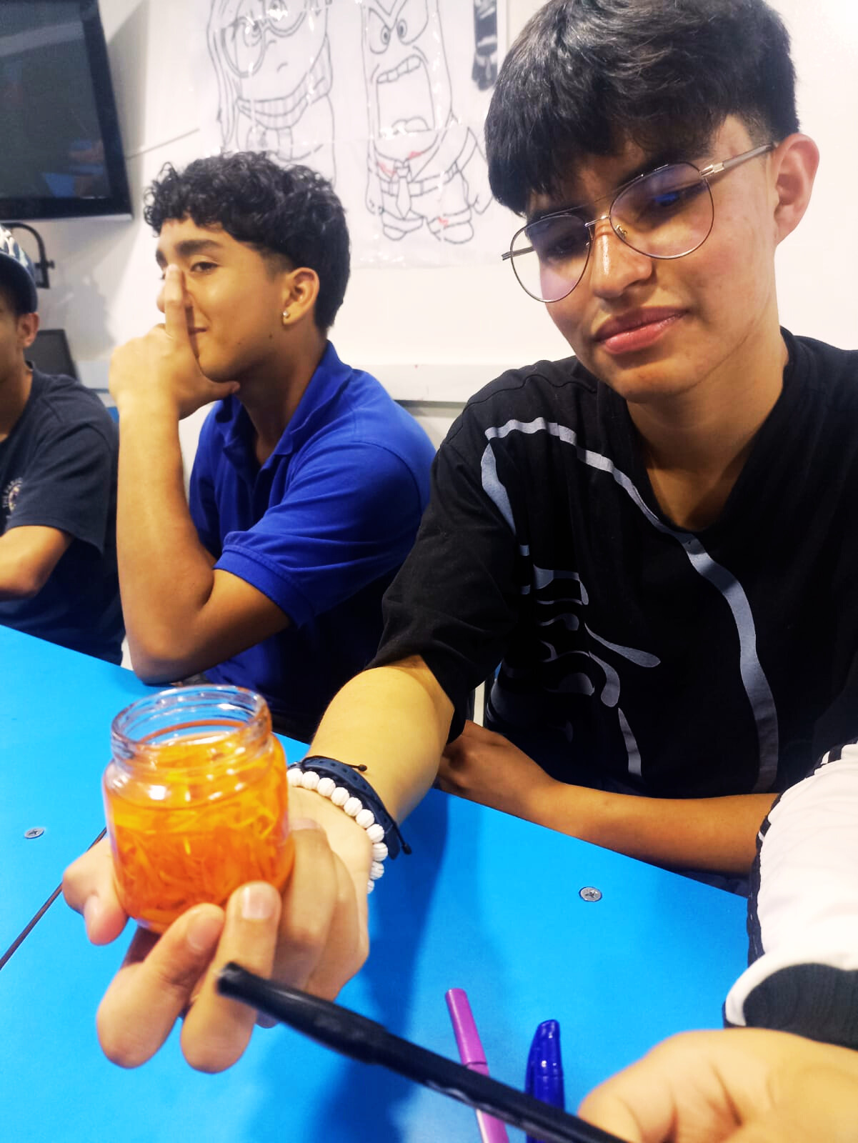 [Image of people working in an urban garden with plants and tools]